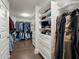 Spacious walk-in closet with custom shelving, drawers, and hanging storage at 682 Pontoon Rd, Huger, SC 29450