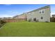 Well-maintained backyard with a lush green lawn and fenced-in patio area at 700 Silver Moss Dr, Moncks Corner, SC 29461