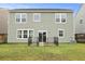 View of a backyard with an in-ground patio featuring metal fence enclosure at 700 Silver Moss Dr, Moncks Corner, SC 29461