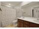 Well-lit bathroom featuring a double sink vanity, toilet, and shower with patterned curtain at 700 Silver Moss Dr, Moncks Corner, SC 29461