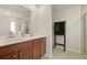 Bright bathroom featuring double vanity, tiled floors, and glass enclosed shower at 700 Silver Moss Dr, Moncks Corner, SC 29461