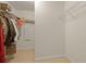 Walk-in closet featuring shelving, hanging racks, and neutral carpeting at 700 Silver Moss Dr, Moncks Corner, SC 29461