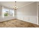 Bright dining room featuring elegant wainscoting and hardwood floors at 700 Silver Moss Dr, Moncks Corner, SC 29461