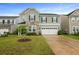 Beautiful two-story house with an attached garage and well-maintained lawn at 700 Silver Moss Dr, Moncks Corner, SC 29461