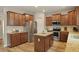 Bright kitchen with stainless steel appliances, granite countertops, wooden cabinets, and island at 700 Silver Moss Dr, Moncks Corner, SC 29461