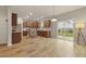Well-lit kitchen featuring wood cabinets and a convenient kitchen island at 700 Silver Moss Dr, Moncks Corner, SC 29461