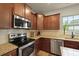 Close up of a kitchen with stainless steel appliances and granite countertops at 700 Silver Moss Dr, Moncks Corner, SC 29461