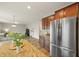 Open kitchen featuring granite countertops and stainless steel refrigerator and view of living area at 700 Silver Moss Dr, Moncks Corner, SC 29461