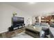 Spacious living room with a large television and comfortable sectional sofa at 700 Silver Moss Dr, Moncks Corner, SC 29461