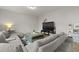 Comfortable living room with a modern entertainment center and cozy sectional sofa at 700 Silver Moss Dr, Moncks Corner, SC 29461