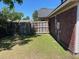 Fenced-in backyard featuring a well-maintained lawn and perimeter fencing for added privacy at 7733 Buck Pond Rd, North Charleston, SC 29418