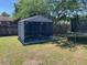 Backyard showing well-kept lawn, fenced area, and play equipment for entertainment at 7733 Buck Pond Rd, North Charleston, SC 29418