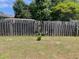 Backyard with wooden fence and a small amount of grass visible, adding to the outdoor space at 7733 Buck Pond Rd, North Charleston, SC 29418