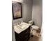 Cozy bathroom featuring a dark wood vanity and toilet at 7733 Buck Pond Rd, North Charleston, SC 29418