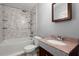 This newly remodeled bathroom offers a standing tile shower, toilet and custom tile countertop sink at 7733 Buck Pond Rd, North Charleston, SC 29418