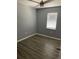 Clean bedroom with fan and modern ceiling fan and light wood floor at 7733 Buck Pond Rd, North Charleston, SC 29418