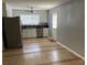 Spacious kitchen featuring stainless steel appliances and ample cabinet space at 7733 Buck Pond Rd, North Charleston, SC 29418