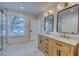 Bathroom featuring double vanity with marble countertop, two mirrors, and stylish fixtures at 841 Fred St, Charleston, SC 29412