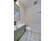 Modern bathroom with decorative tile, green vanity, and a gold-trimmed mirror for a stylish and functional space at 841 Fred St, Charleston, SC 29412