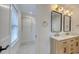 Bathroom showcasing a double vanity, modern mirrors, stylish fixtures, and walk-in closet at 841 Fred St, Charleston, SC 29412