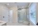 Bathroom featuring a glass-enclosed shower with marble tile and modern fixtures at 841 Fred St, Charleston, SC 29412