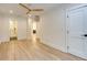 Bright bedroom featuring hardwood floors, ceiling fan, and doorway view to the bathroom at 841 Fred St, Charleston, SC 29412