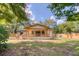 Rear exterior of a home showcasing a covered porch, wooden deck, and shaker siding at 841 Fred St, Charleston, SC 29412