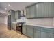 Stylish kitchen with stainless steel appliances, light countertops, and gray colored cabinets at 841 Fred St, Charleston, SC 29412