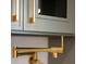 Close-up of gold hardware and pot filler faucet at 841 Fred St, Charleston, SC 29412