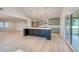 Spacious kitchen featuring a large island, stainless steel appliances, and access to the outdoor deck at 841 Fred St, Charleston, SC 29412