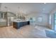 Bright and open-concept kitchen with hardwood floors, recessed lighting, and a large island at 841 Fred St, Charleston, SC 29412