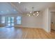 Bright living room with hardwood floors, modern lighting, and sliding glass doors to the deck at 841 Fred St, Charleston, SC 29412