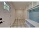 Inviting mudroom with decorative tile, built-in storage, and easy access to the exterior at 841 Fred St, Charleston, SC 29412