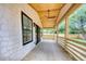 Covered porch with wooden ceiling, ceiling fan, and sliding glass doors to access the house at 841 Fred St, Charleston, SC 29412