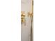 Close-up of modern gold shower fixtures against a marble tile wall at 841 Fred St, Charleston, SC 29412