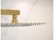 Modern bathroom features a sleek, square shower head with gold hardware against a clean, white backdrop at 841 Fred St, Charleston, SC 29412