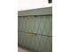 Close-up of a modern bathroom vanity with gold hardware and a unique diamond patterned design at 841 Fred St, Charleston, SC 29412