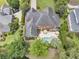 Overhead view of a brick home with a backyard pool, patio, and lush greenery surrounding the property at 8662 W Fairway Woods Dr, North Charleston, SC 29420