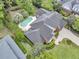 Aerial view of a luxury home with a private backyard swimming pool and mature landscaping at 8662 W Fairway Woods Dr, North Charleston, SC 29420
