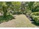 Expansive backyard with lush grass and manicured bushes, a tranquil outdoor space at 8662 W Fairway Woods Dr, North Charleston, SC 29420