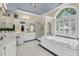 Beautiful bathroom featuring a soaking tub, walk-in shower, and dual vanities at 8662 W Fairway Woods Dr, North Charleston, SC 29420