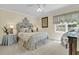 Stylish bedroom with a queen bed and decor at 8662 W Fairway Woods Dr, North Charleston, SC 29420