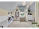 Attic bedroom featuring a chest, white shelving, and a window with valance at 8662 W Fairway Woods Dr, North Charleston, SC 29420