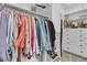 Custom walk-in closet with copper hanging rod, built-in shelving, and drawers at 8662 W Fairway Woods Dr, North Charleston, SC 29420