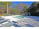Inviting community pool with lounge chairs perfect for relaxing and enjoying the sunshine at 8662 W Fairway Woods Dr, North Charleston, SC 29420