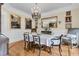 Formal dining room featuring a chandelier, hardwood floors, and elegant decor at 8662 W Fairway Woods Dr, North Charleston, SC 29420