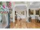 Welcoming foyer with hardwood floors, a staircase, and access to the living areas at 8662 W Fairway Woods Dr, North Charleston, SC 29420