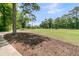 Scenic view of the golf course, with lush green grass and mature trees at 8662 W Fairway Woods Dr, North Charleston, SC 29420