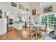 Open concept kitchen with an adjacent breakfast nook, and stainless steel appliances at 8662 W Fairway Woods Dr, North Charleston, SC 29420