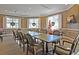 Well-appointed meeting room with table, chairs, holiday decorations, and a mounted TV at 8662 W Fairway Woods Dr, North Charleston, SC 29420